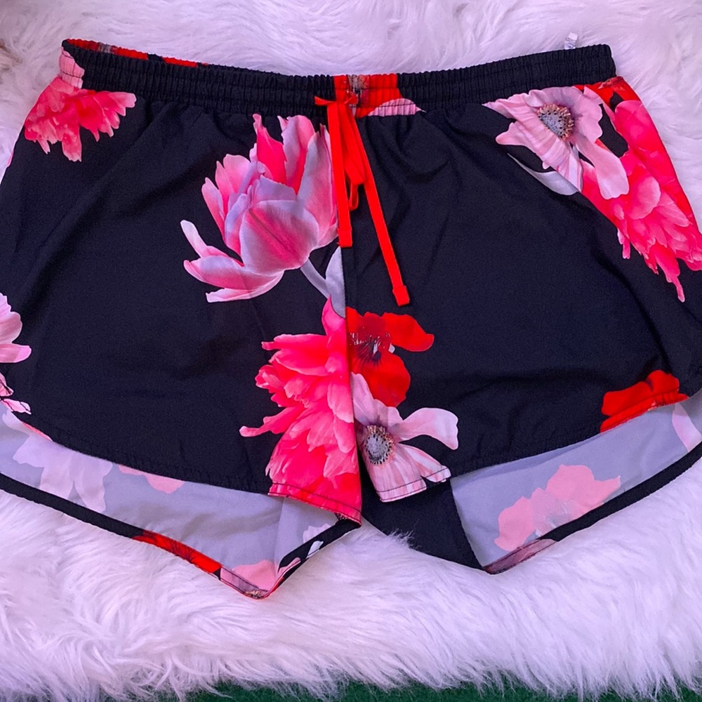 red floral shorts